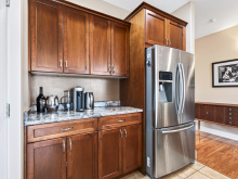1064 Cordero Cres - kitchen cabinetry and fridge
